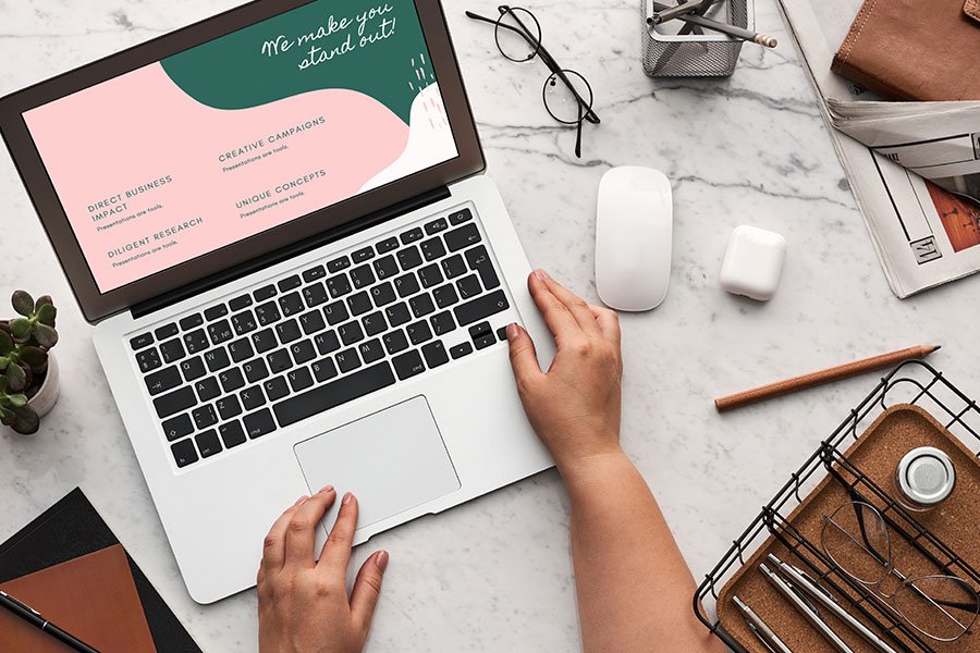 Person working on a laptop displaying a creative business presentation. Person working on a laptop displaying a creative business presentation.