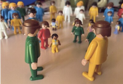 Toy figures gathered in a colorful scene.